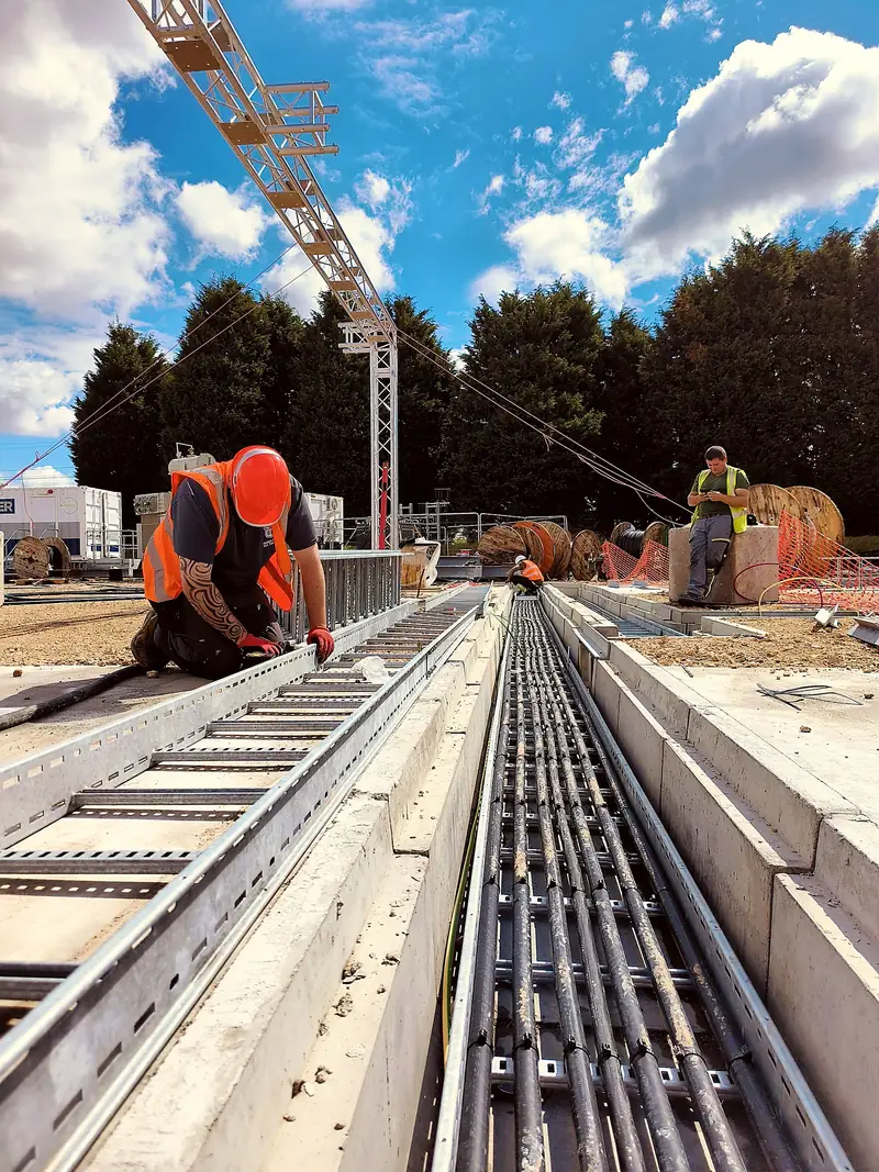 MTM operative installing cable containment