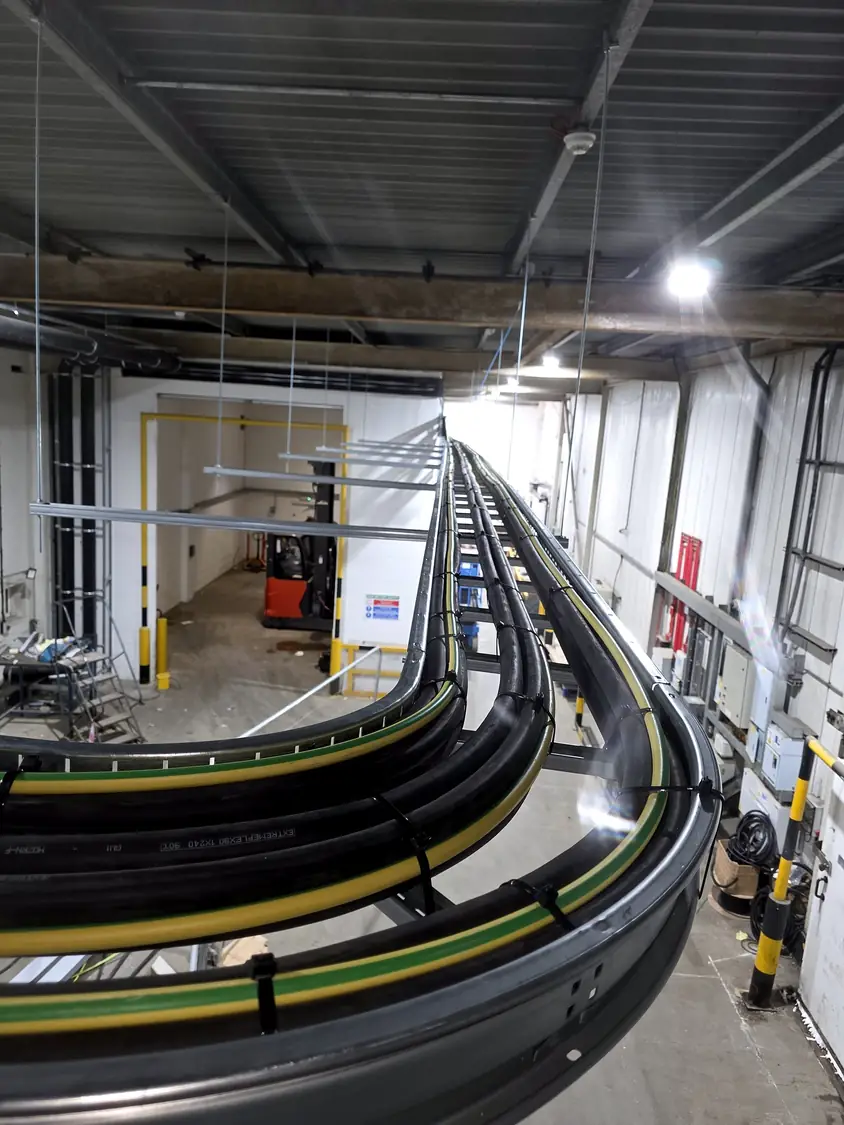 Ladder rack carrying large AC cables at high level · Coldstar Refrigeration