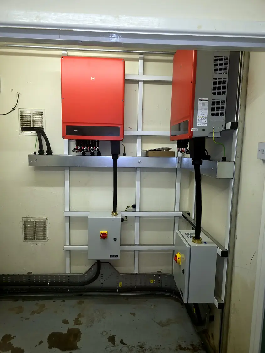 Completed inverter installation: two GoodWe inverters with AC isolators