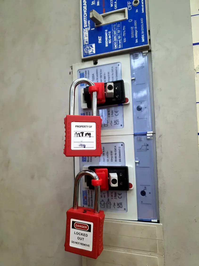 MCCBs locked off with lockout devices and padlocks