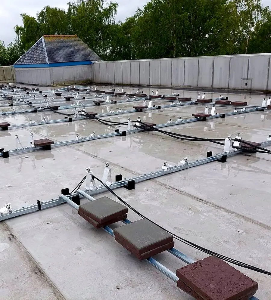 Concrete ballast blocks on the mounting rails